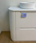 Close-up styling shot of the Aulic Curva 900mm floor standing vanity