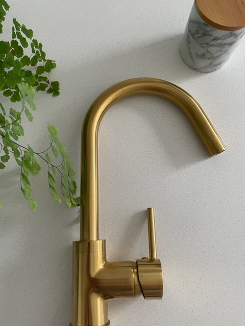 Swan neck gold tap